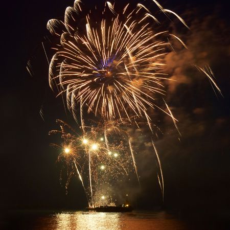 Fireworks, salute with the black sky backgroundの写真素材