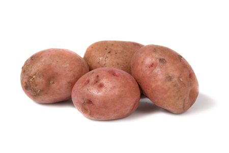 Stack of potatoes isolated on white backgroundの写真素材