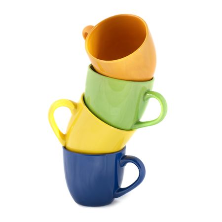 Tower of color cups isolated on whiteの写真素材