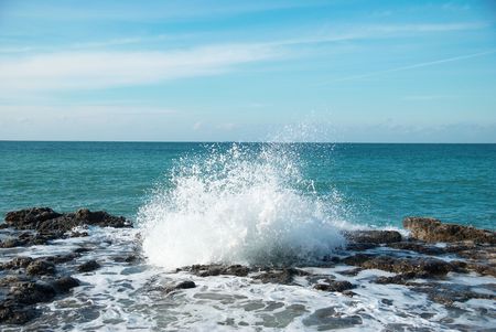 Big waves breaking on the shore with sea foamの写真素材