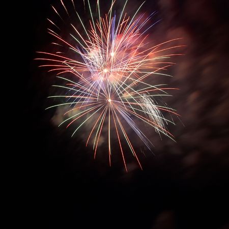 Fireworks, salute with the black sky backgroundの写真素材