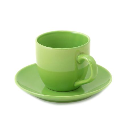 Green teacup and saucer isolated on whiteの写真素材