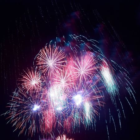 Beautiful fireworks on the black sky backgroundの写真素材