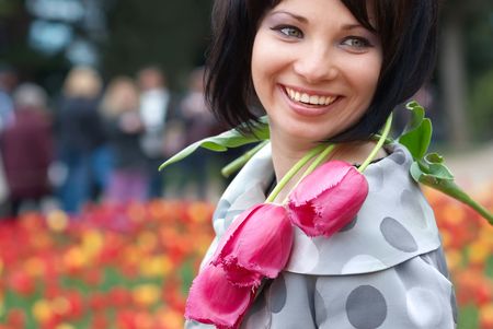 Pretty girl with tulips with soft backgroundの写真素材