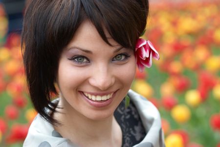 Pretty girl with tulip with soft backgroundの写真素材