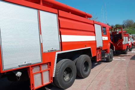Red fire engine standing on the road