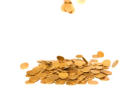 Rain of golden coins isolated on whiteの写真素材