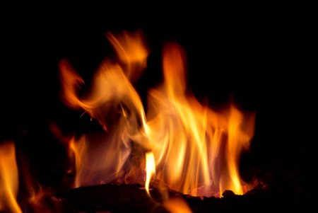 Tongues of flame with the black backgroundの写真素材