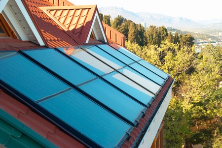 Solar system on the red house roofの写真素材