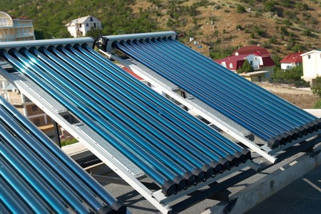 Vacuum solar water heating system on the house roof.の写真素材