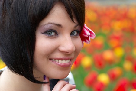 Pretty girl with tulips with soft backgroundの写真素材