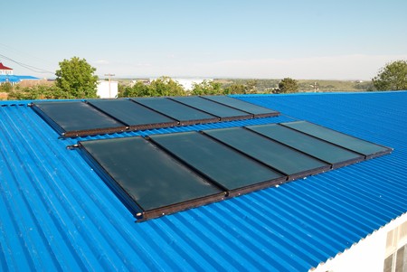 Solar water heating system on the house roof.の写真素材