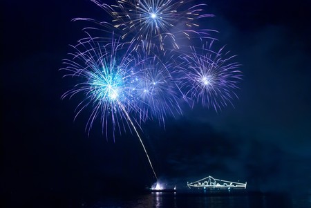 Blue fireworks on the black sky backgroundの写真素材
