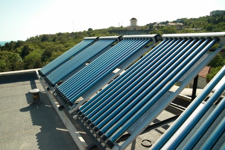 Vacuum solar water heating system on the house roof.の写真素材