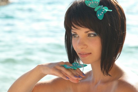 Young woman with butterflies on the handの写真素材