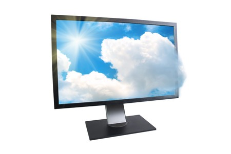 LCD monitor with sun and clouds outside isolated on whiteの写真素材