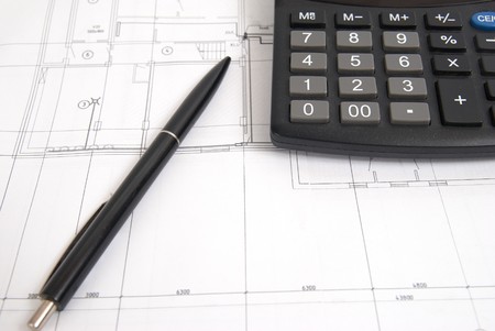 Working drawing with calculator and pen. Engineering equipment.の写真素材