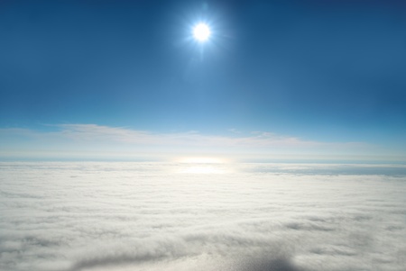 Sun, blue sky, and ocean of clouds の写真素材
