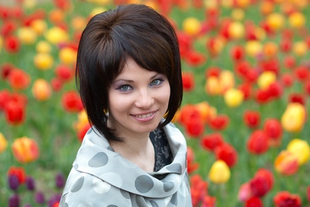 Pretty girl with tulips with soft backgroundの写真素材