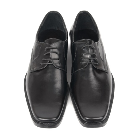 Pair of man's black shoes isolated on white backgroundの写真素材