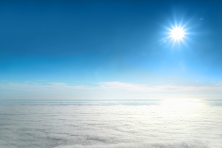 Sun, blue sky, and ocean of clouds の写真素材