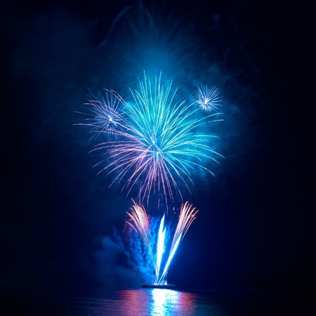 Colorful fireworks on the black sky backgroundの写真素材