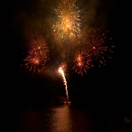 Colorful fireworks on the black sky backgroundの写真素材