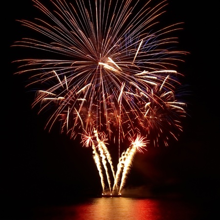 Colorful fireworks on the black sky backgroundの写真素材