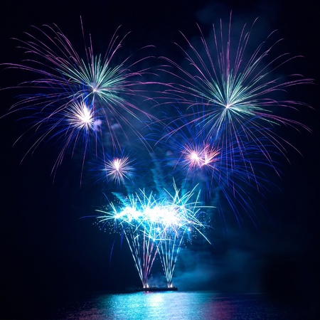 Colorful fireworks on the black sky backgroundの写真素材