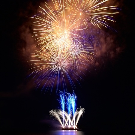 Colorful fireworks on the black sky backgroundの写真素材