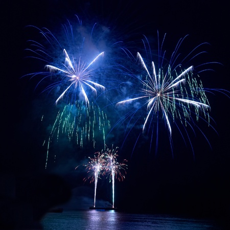 Colorful fireworks on the black sky backgroundの写真素材