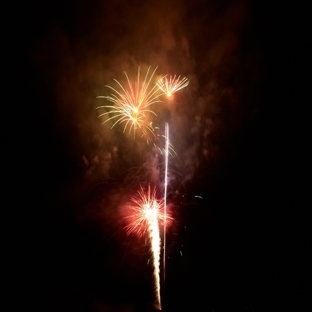 Colorful fireworks on the black sky backgroundの写真素材