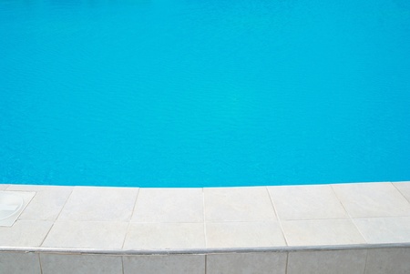 Big swimming pool with shiny blue watter