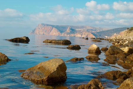 Sea, shore and stones. Seascape at sunset.の写真素材