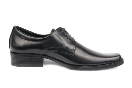 Left man's black shoe isolated on white backgroundの写真素材