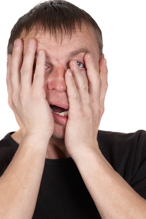 Very scared young man. Portrait on white background の写真素材