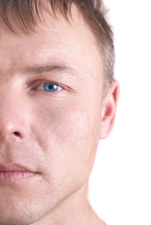 Handsome young man's face. Close up portrait on white background の写真素材