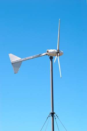 Wind electric turbine generator at blue sky backgroundの写真素材