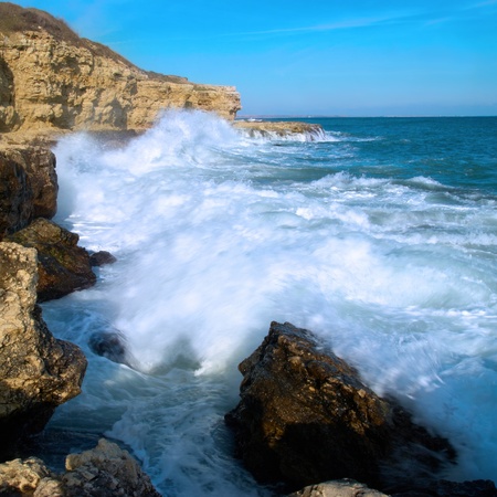 Big waves breaking on the shore with sea foamの写真素材