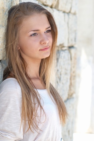 Beautiful blond girl outdoors against the sea の写真素材