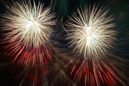 Colorful fireworks on the black sky backgroundの写真素材
