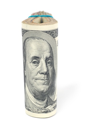 Stack of money- cash of US dollars with Benjamin Franklin isolated on white backgroundの写真素材