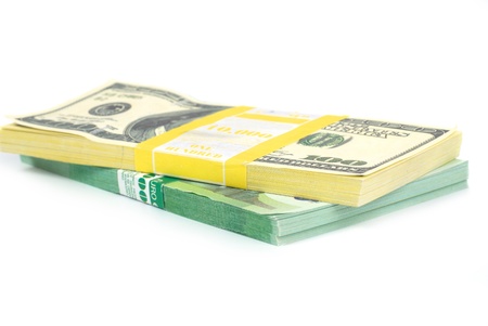 Stack of money- cash of US dollars and euros isolated on white backgroundの写真素材