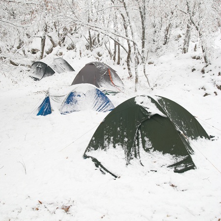 Winter tent camp in the snow forestの写真素材