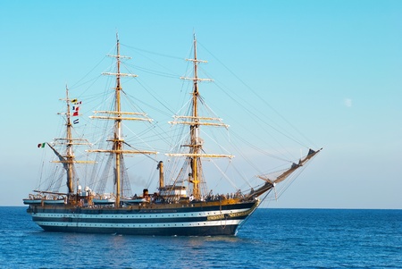 Beautiful sailing vessel in the sea comes into bayの写真素材