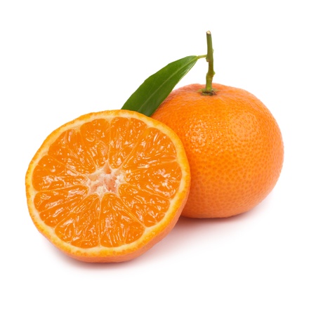 Two orange mandarins with green leaf isolated on white backgroundの写真素材