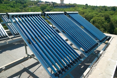 Vacuum solar water heating system on the house roof.の写真素材