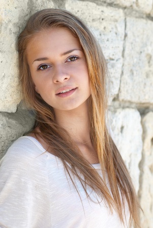Beautiful blond girl outdoors against the sea の写真素材