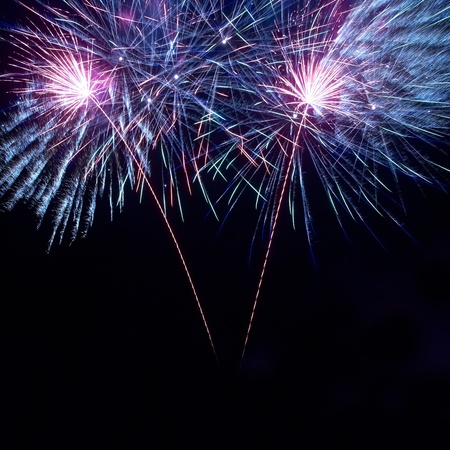 Colorful fireworks on the black sky backgroundの写真素材