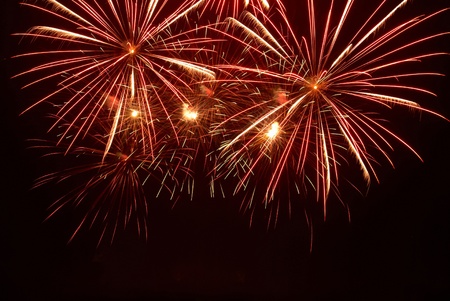Fireworks, salute on the black sky backgroundの写真素材